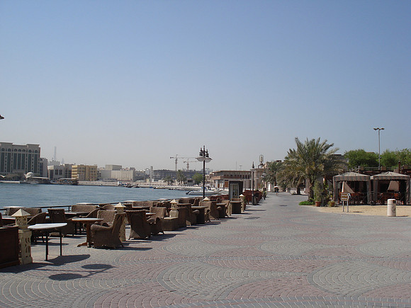 Restaurant tables along the Dubai Creek at Al Shindagha Rd, Dubai - UAE.