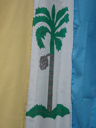 The Penang flag featuring a betelnut tree, from which the island takes its name. Georgetown, Penang - Malaysia.