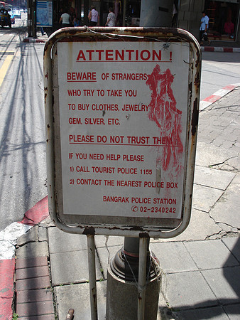 "Beware of strangers who try to take you to buy clothes, jewelry, gem, silver etc".  Tuk-tuk touts are known to try an lure tourists to overpriced shops. Bangkok - Thailand.